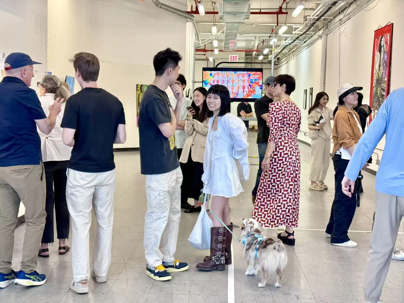 Guests talking and exploring an art and design gathering together